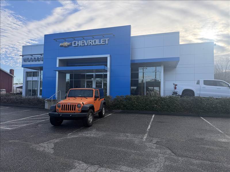 Wow Woodbury Chevrolet Collision Repair Center Logo